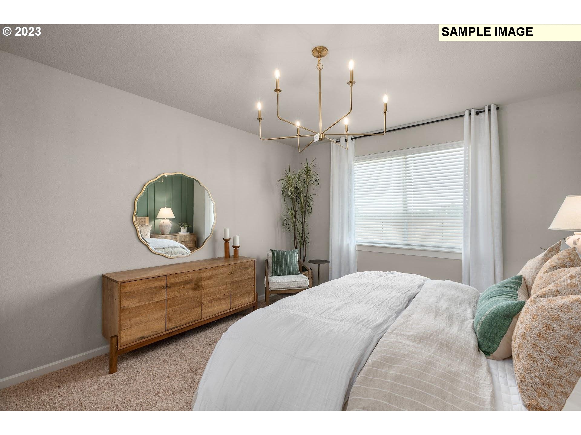 2364 Southeast Teal Avenue Gresham, OR 97080 - Photo 7 of 20 a bedroom with furniture and a mirror
