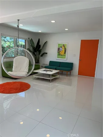 a view of a patio with table and chairs