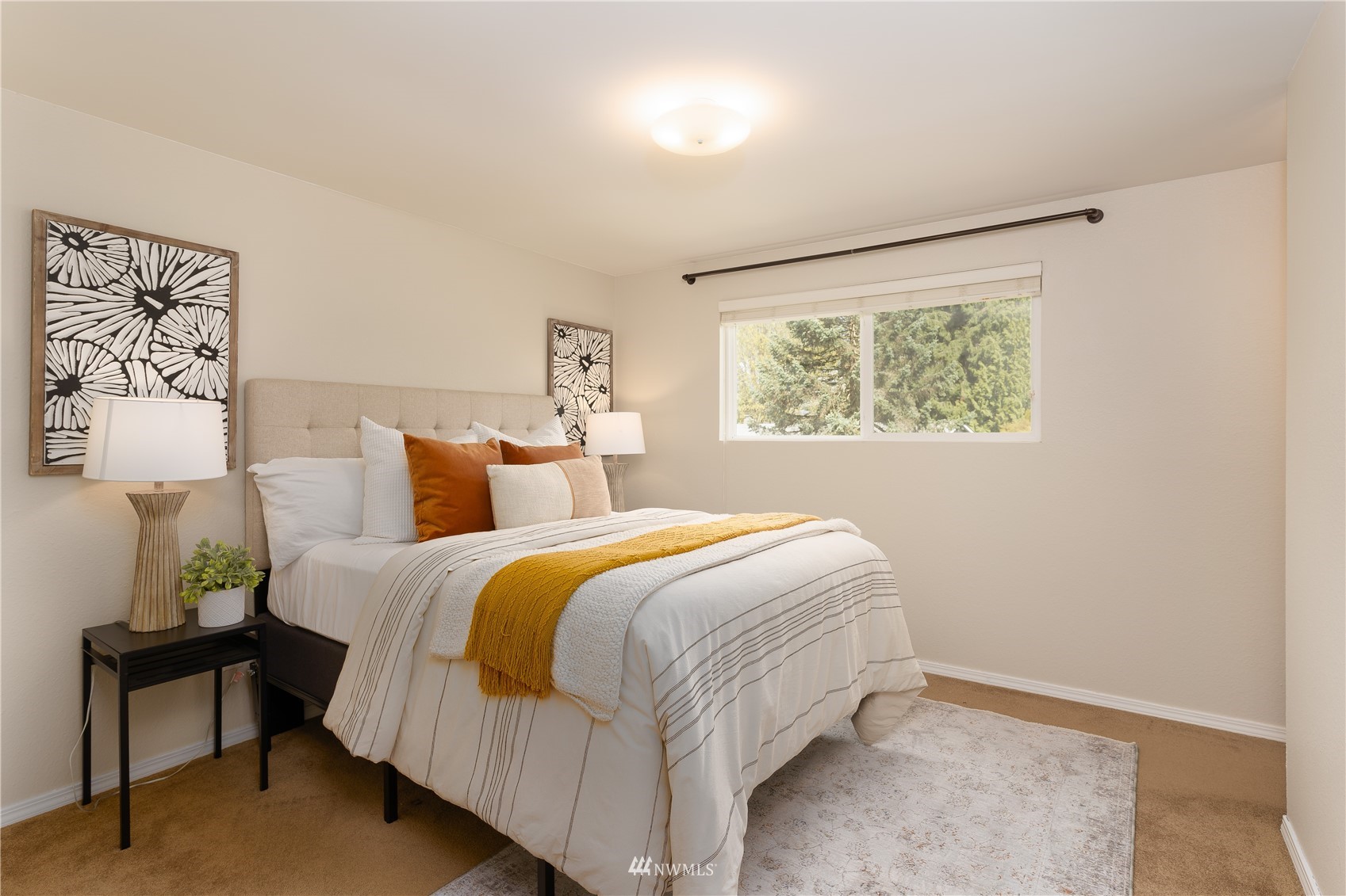 212 225th Street Southwest Bothell, WA 98021 - Photo 14 of 31 a bedroom with a bed and a lamp on the dresser