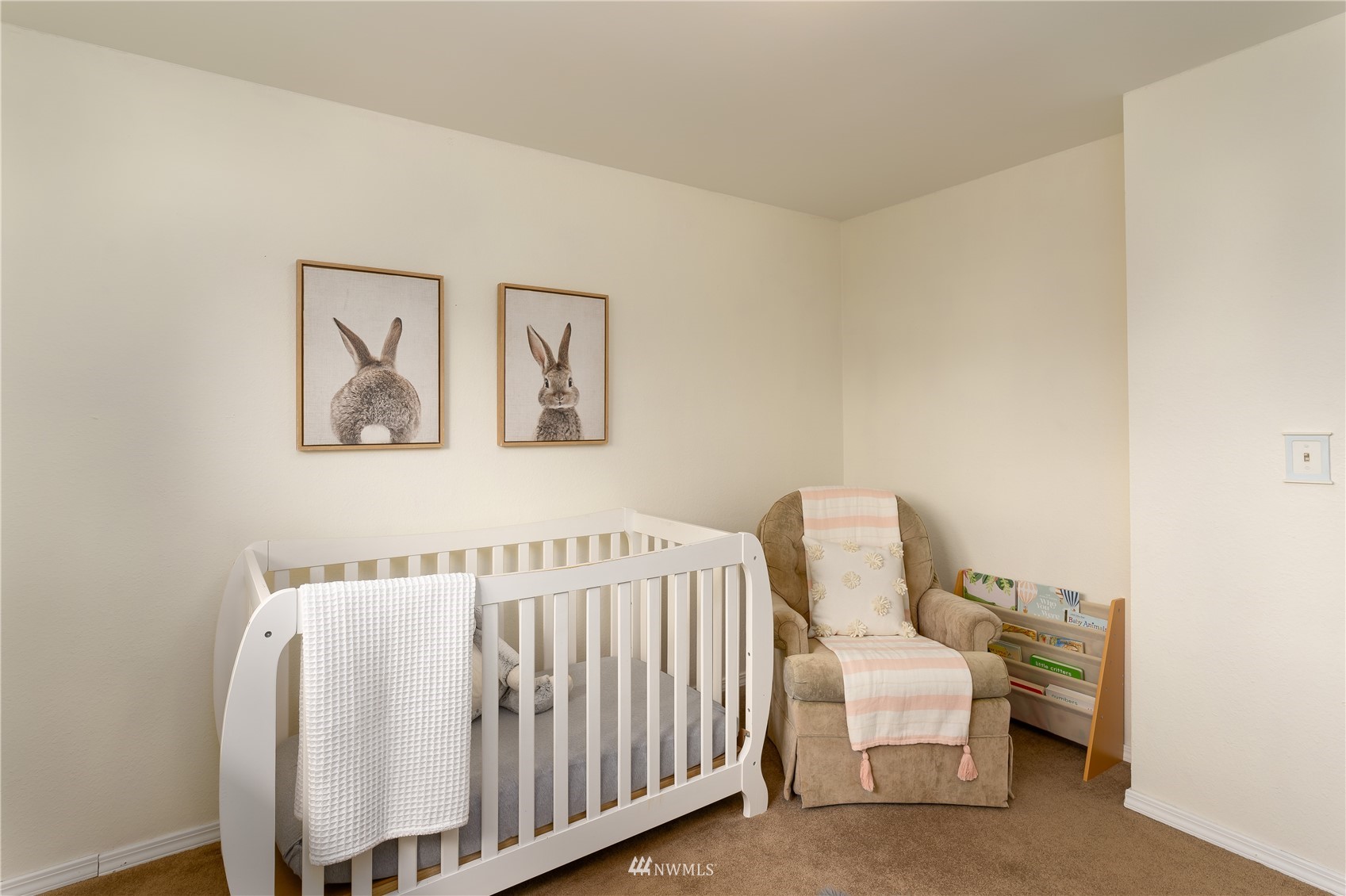 212 225th Street Southwest Bothell, WA 98021 - Photo 19 of 31 a bedroom with a bed and a chair