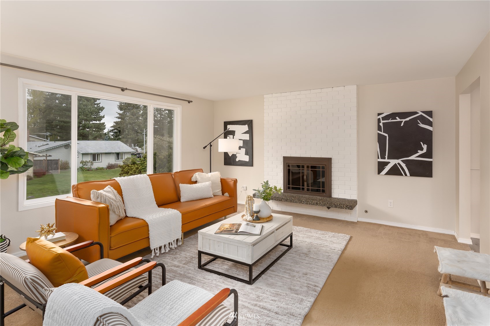 212 225th Street Southwest Bothell, WA 98021 - Photo 6 of 31 a living room with furniture large window and a fireplace
