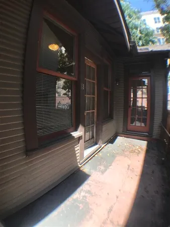 a view of room with furniture and flat screen tv