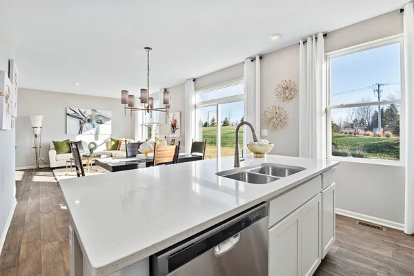 a large kitchen with kitchen island a large counter space