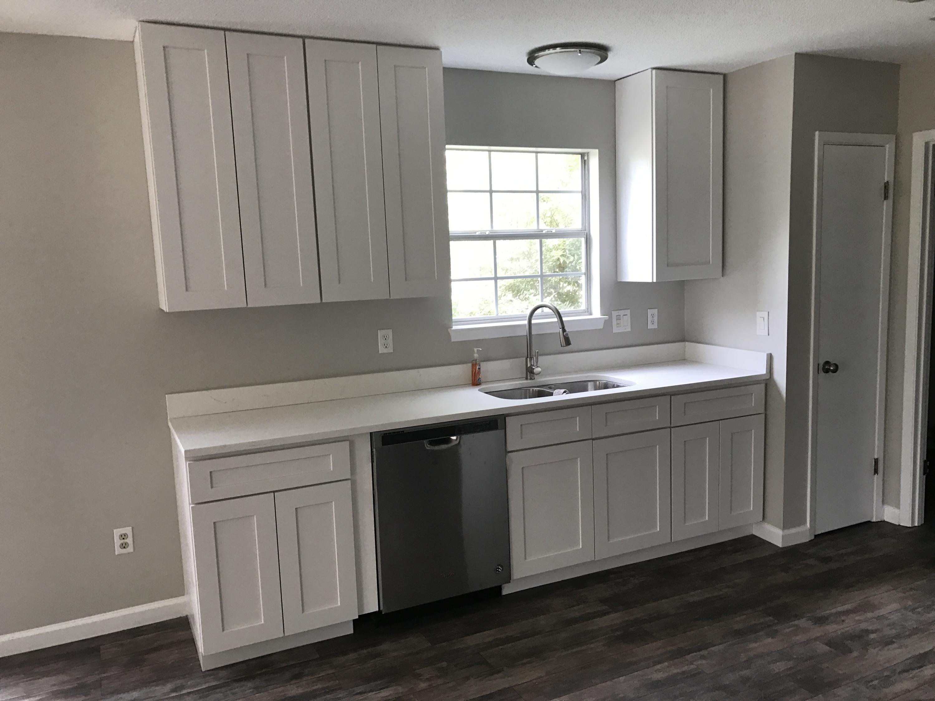 2839 Old Mill Way Crestview, FL 32539 - Photo 4 of 28 a kitchen with a sink cabinets and window