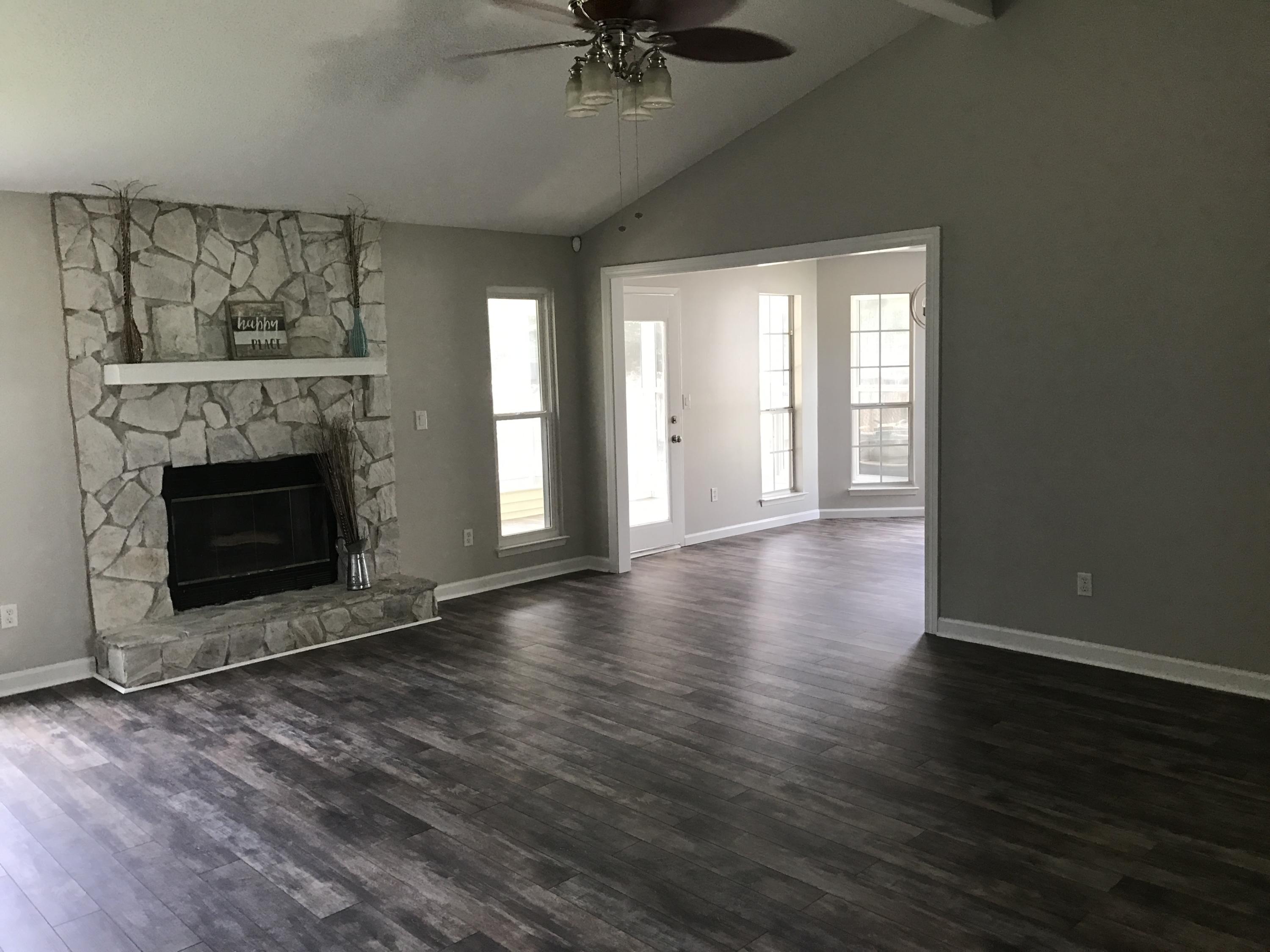 2839 Old Mill Way Crestview, FL 32539 - Photo 8 of 28 wooden floor fireplace and windows in an empty room