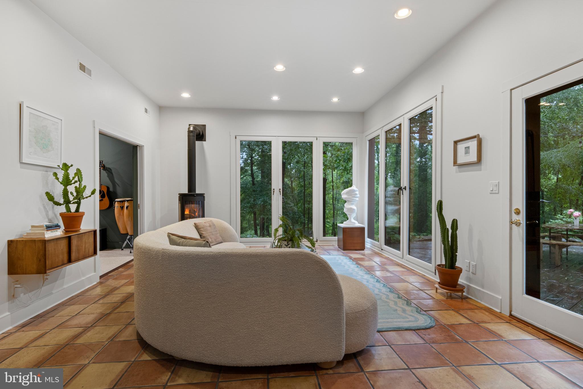 1420 Little Conestoga Road Glenmoore, PA 19343 - Photo 16 of 51 a living room with furniture and large windows