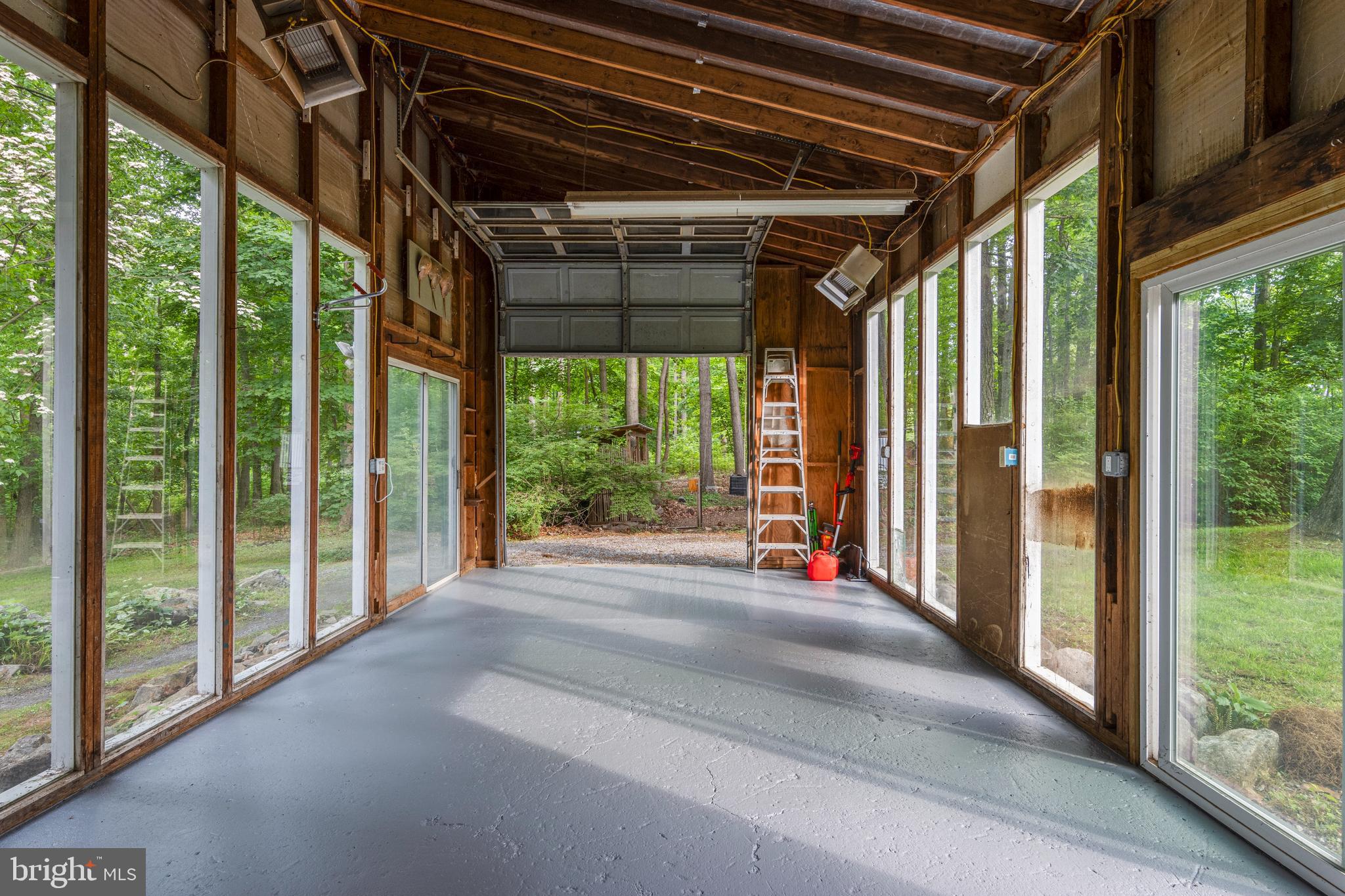 1420 Little Conestoga Road Glenmoore, PA 19343 - Photo 47 of 51 a view of porch with a floor to ceiling window