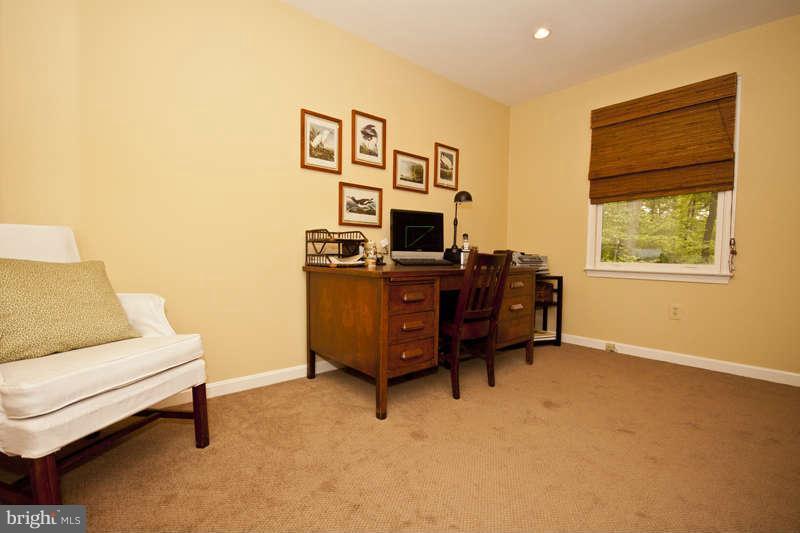 115 Houck Road Westminster, MD 21157 - Photo 12 of 30 a view of a workspace with furniture and a window