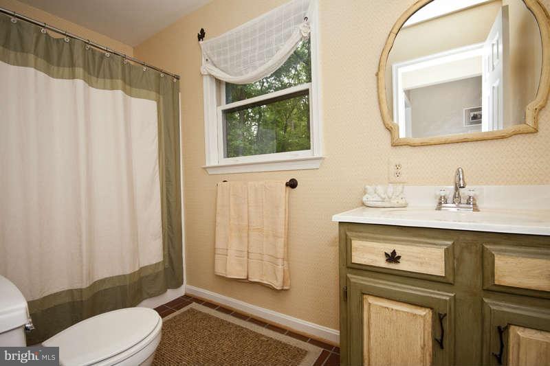 115 Houck Road Westminster, MD 21157 - Photo 13 of 30 a bathroom with a sink vanity mirror and toilet