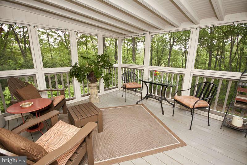 115 Houck Road Westminster, MD 21157 - Photo 15 of 30 a balcony with wooden floor and outdoor seating