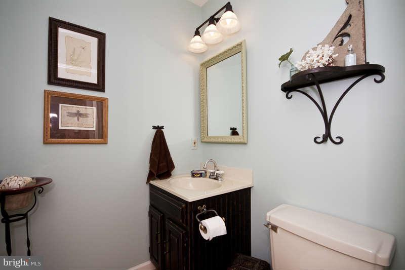 115 Houck Road Westminster, MD 21157 - Photo 17 of 30 a bathroom with a toilet sink and mirror