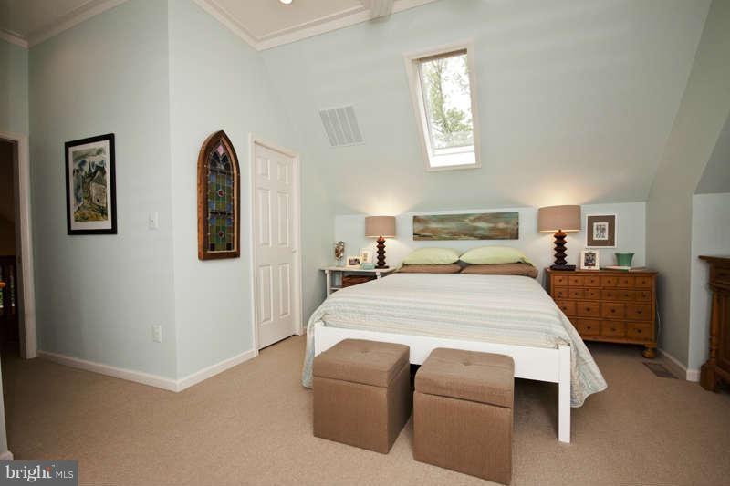 115 Houck Road Westminster, MD 21157 - Photo 19 of 30 a bedroom with a large bed and a painting on the wall