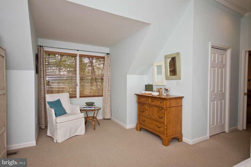 115 Houck Road Westminster, MD 21157 - Photo 20 of 30 a living room with furniture and a dresser next to a window
