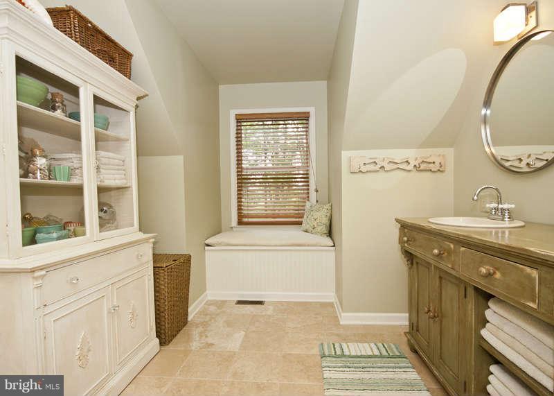 115 Houck Road Westminster, MD 21157 - Photo 21 of 30 a bathroom with a sink and a mirror