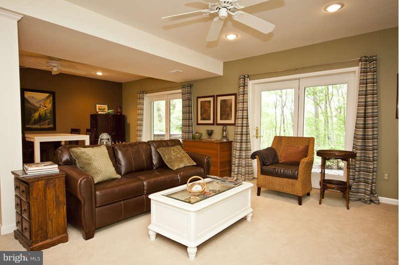 115 Houck Road Westminster, MD 21157 - Photo 26 of 30 a living room with furniture and a flat screen tv
