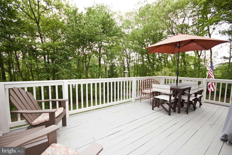 115 Houck Road Westminster, MD 21157 - Photo 28 of 30 a view of a chairs and table under an umbrella