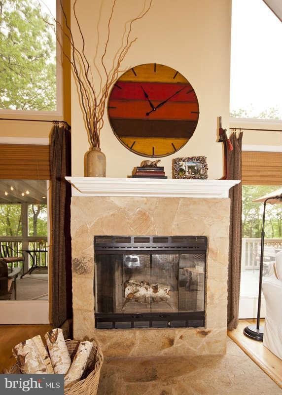 115 Houck Road Westminster, MD 21157 - Photo 8 of 30 a fireplace with a clock on top of it