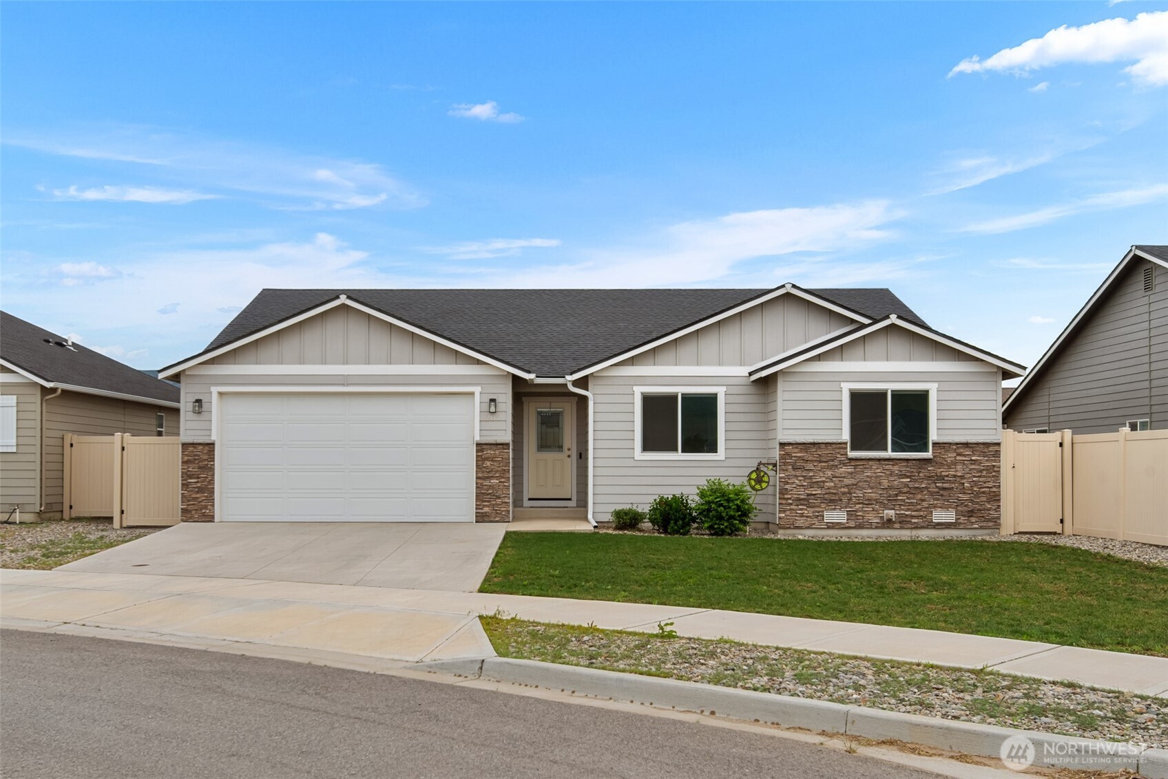 282 Emma Drive Wenatchee, WA 98801 - Photo 1 of 38 a front view of a house with a garden
