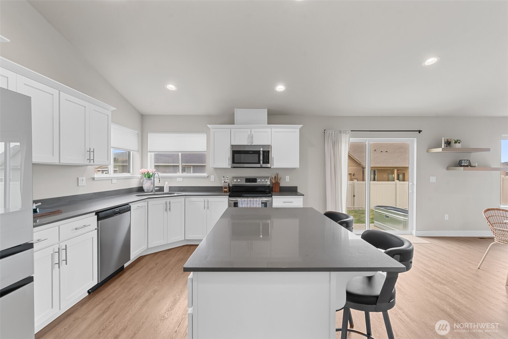 282 Emma Drive Wenatchee, WA 98801 - Photo 11 of 38 a kitchen with sink refrigerator and microwave