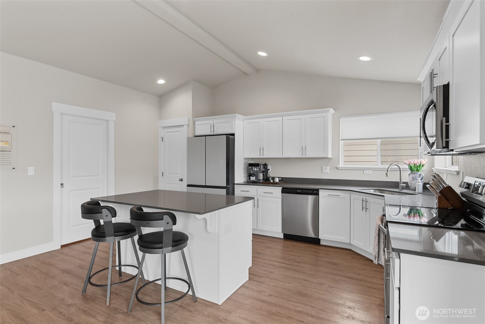 282 Emma Drive Wenatchee, WA 98801 - Photo 15 of 38 a kitchen with stainless steel appliances granite countertop a white cabinets and a stove top oven
