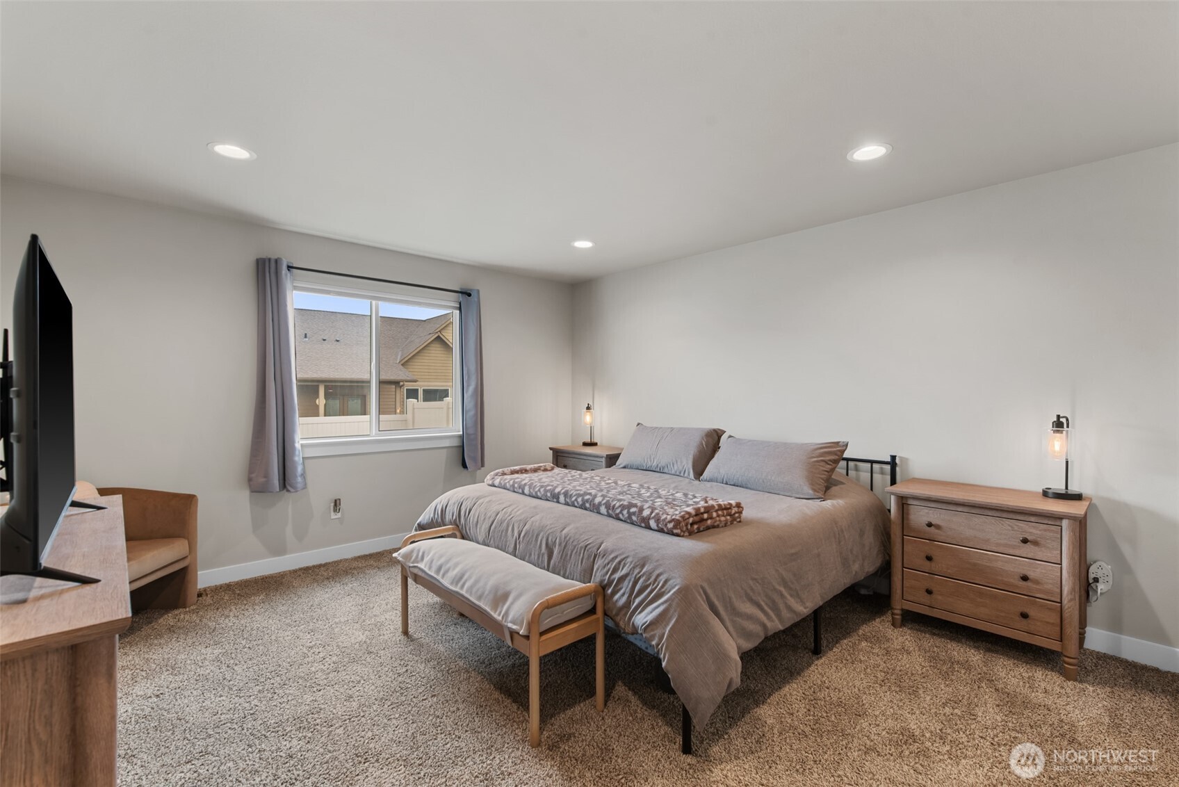 282 Emma Drive Wenatchee, WA 98801 - Photo 18 of 38 a bedroom with a bed a table and a dresser