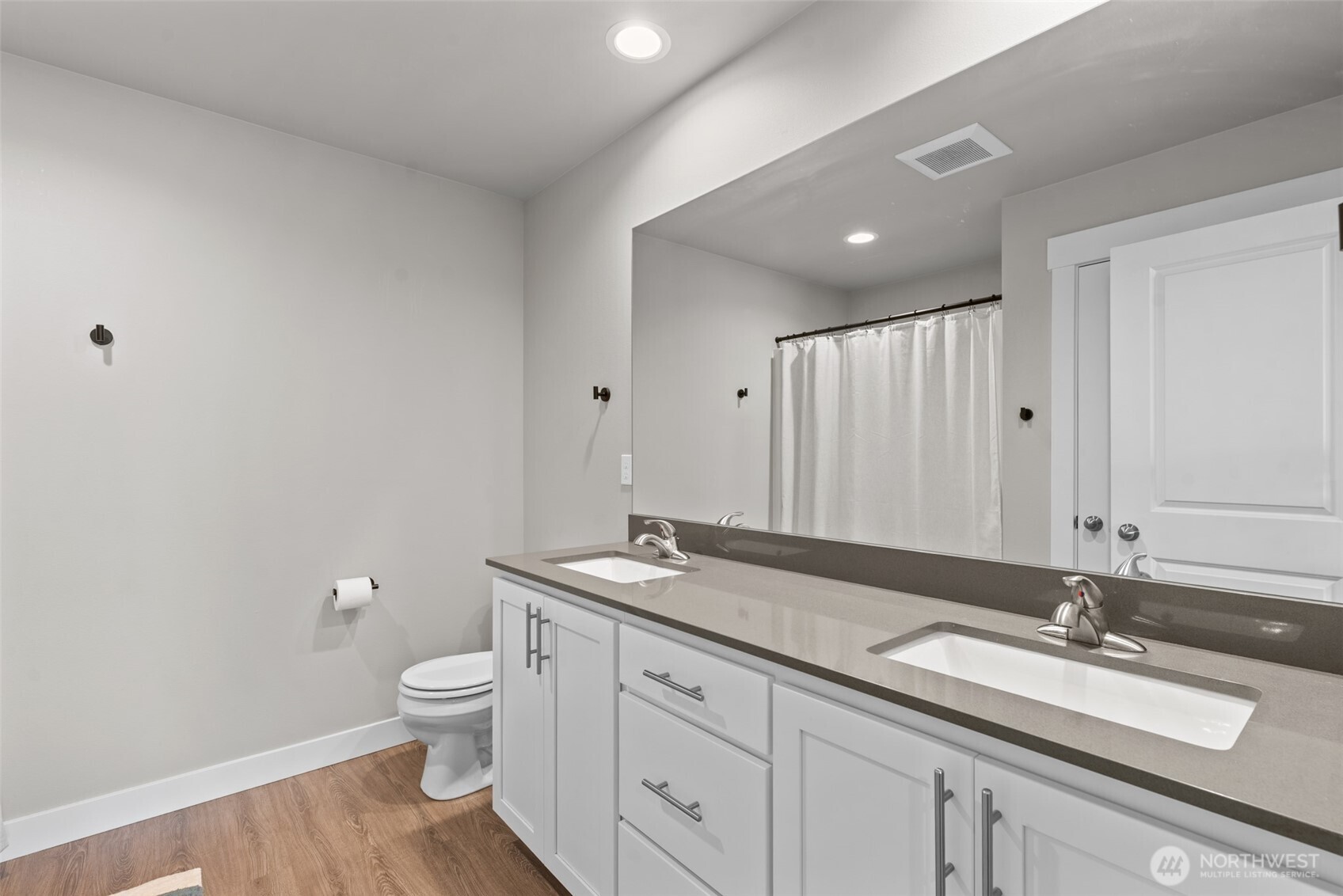 282 Emma Drive Wenatchee, WA 98801 - Photo 20 of 38 a spacious bathroom with a granite countertop sink a toilet and a mirror