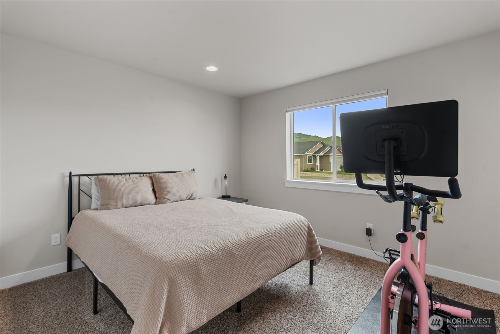 282 Emma Drive Wenatchee, WA 98801 - Photo 23 of 38 a bedroom with a bed and a flat screen tv