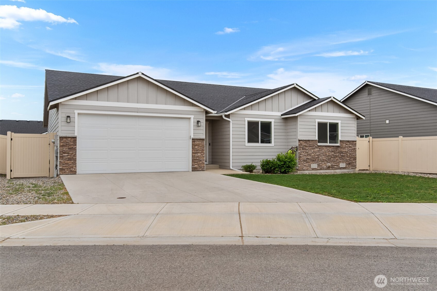 282 Emma Drive Wenatchee, WA 98801 - Photo 38 of 38 a front view of a house with a yard and garage
