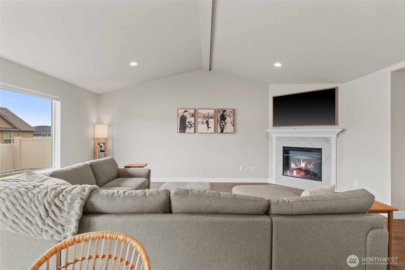 282 Emma Drive Wenatchee, WA 98801 - Photo 7 of 38 a living room with furniture a flat screen tv and a fireplace