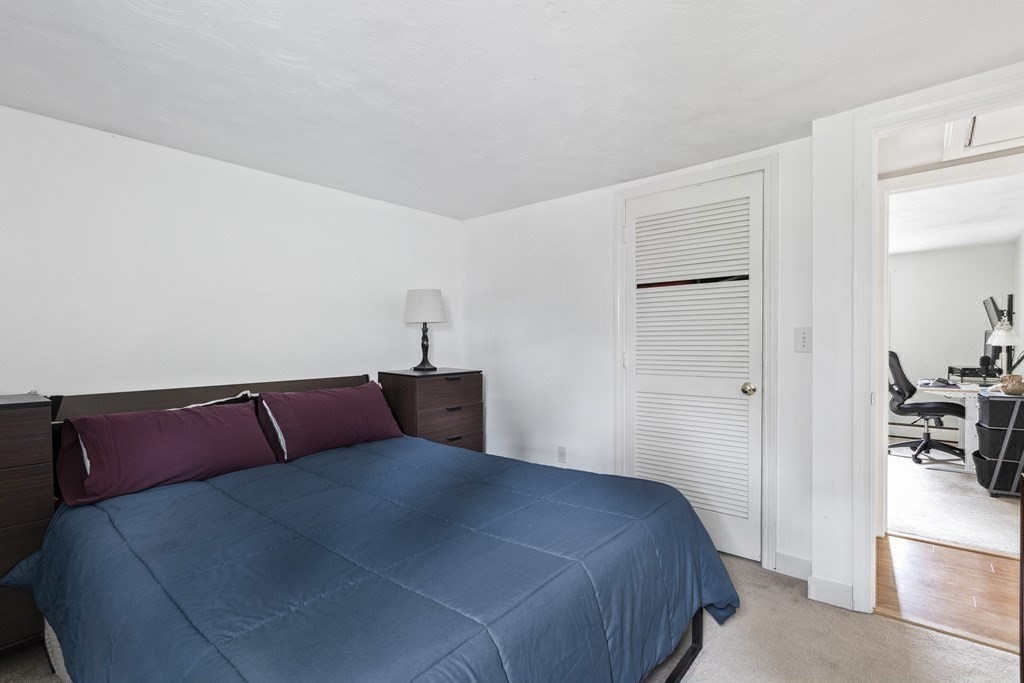 89 Richmond Road Freetown, MA 02702 - Photo 14 of 31 a bedroom with a bed and wooden floor