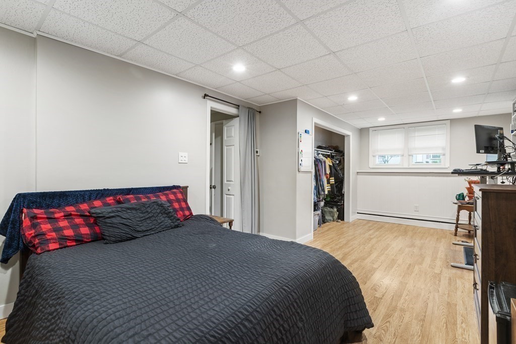 89 Richmond Road Freetown, MA 02702 - Photo 18 of 31 a bedroom with a large bed and a view of living room