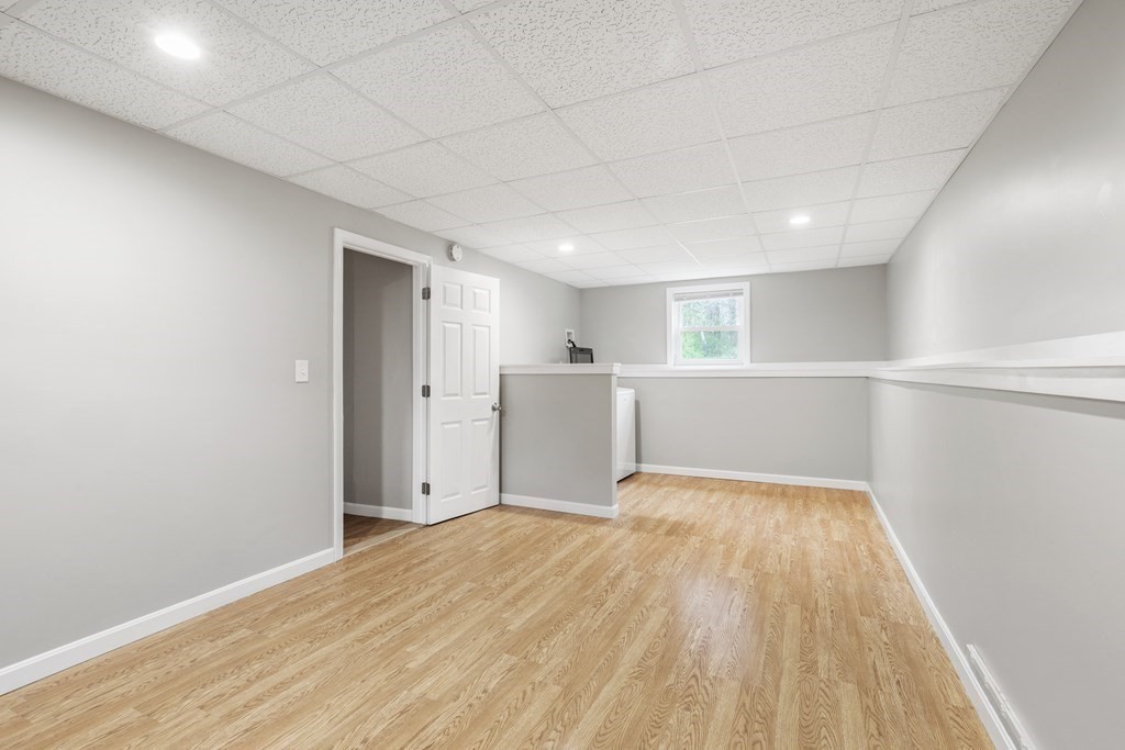 89 Richmond Road Freetown, MA 02702 - Photo 20 of 31 a view of a big room with wooden floor and windows