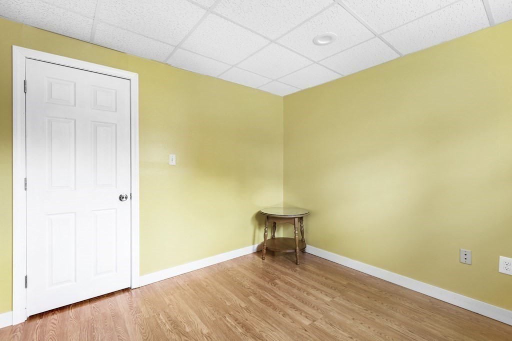 89 Richmond Road Freetown, MA 02702 - Photo 22 of 31 a view of an empty room with wooden floor