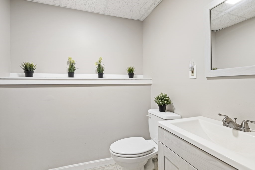 89 Richmond Road Freetown, MA 02702 - Photo 24 of 31 a bathroom with a sink a toilet and mirror