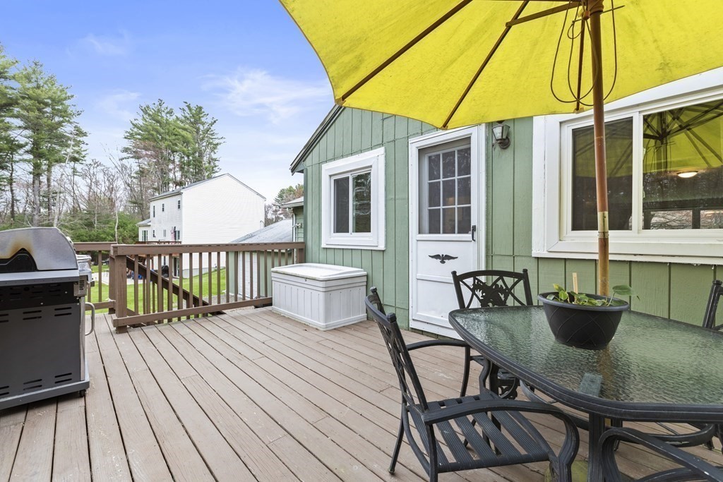 89 Richmond Road Freetown, MA 02702 - Photo 26 of 31 a view of a house with wooden deck and furniture