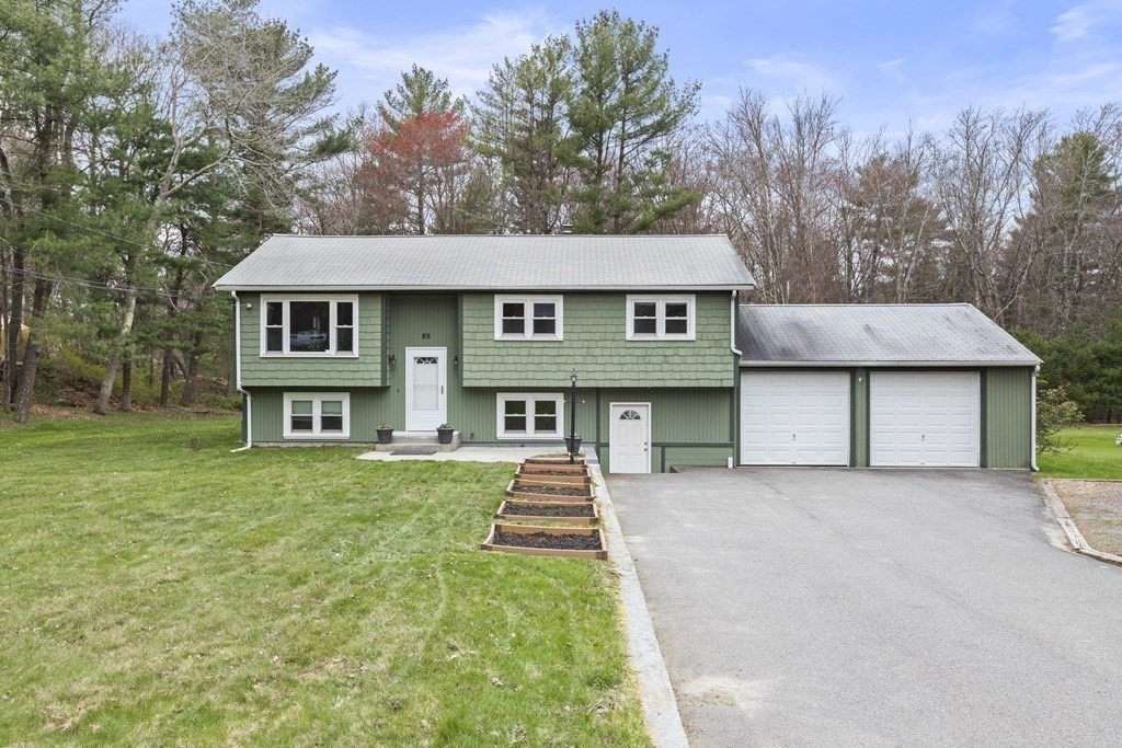 89 Richmond Road Freetown, MA 02702 - Photo 27 of 31 front view of a house with a yard