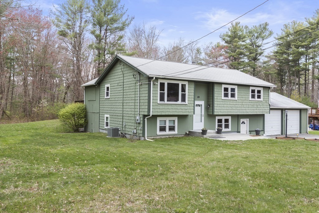 89 Richmond Road Freetown, MA 02702 - Photo 28 of 31 a front view of a house with a garden