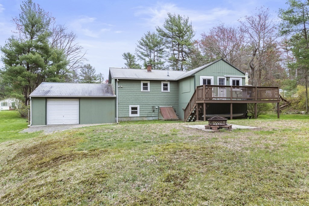 89 Richmond Road Freetown, MA 02702 - Photo 29 of 31 a front view of a house with a yard and garage