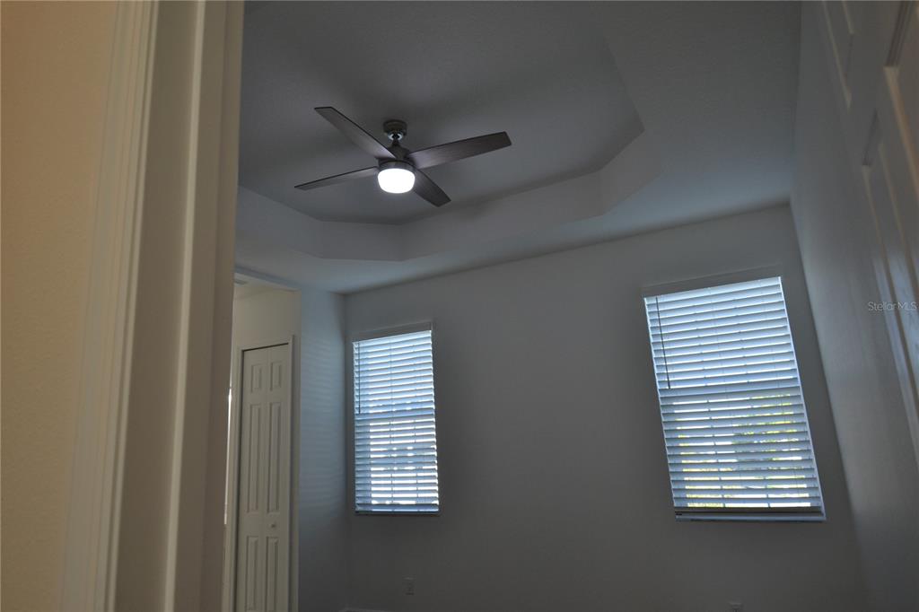 5730 Biscayne Court New Port Richey, FL 34652 - Photo 26 of 35 an empty room with windows and fan