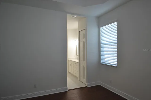 a bathroom with a bathtub sink double and mirror