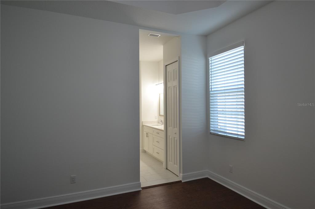 5730 Biscayne Court New Port Richey, FL 34652 - Photo 27 of 35 an empty room with wooden floor and windows