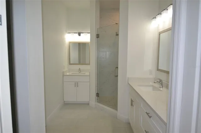 an empty room with a window and wooden floor