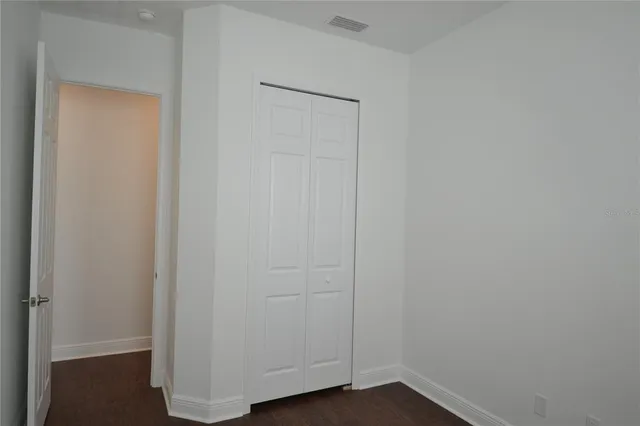 an aerial view of a house with swimming pool and patio