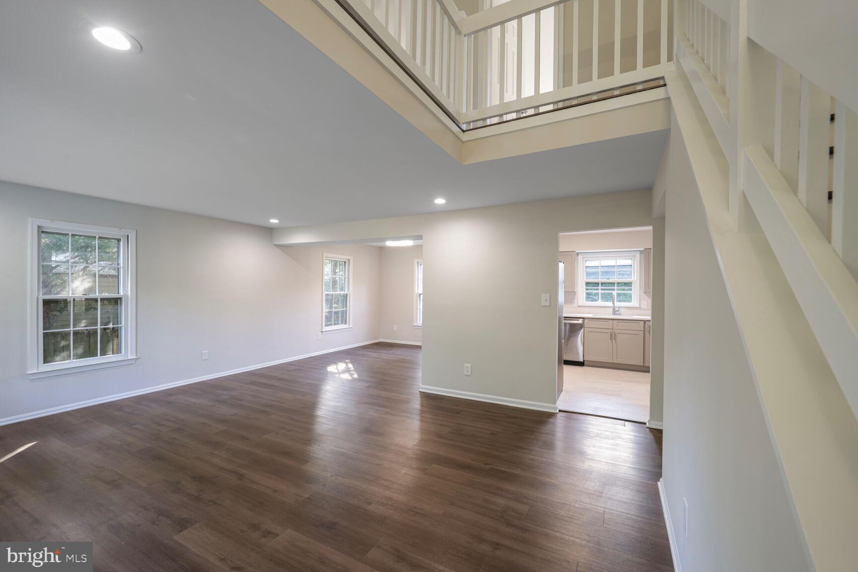 13802 Poplar Tree Road Chantilly, VA 20151 - Photo 12 of 61 an empty room with wooden floor and windows
