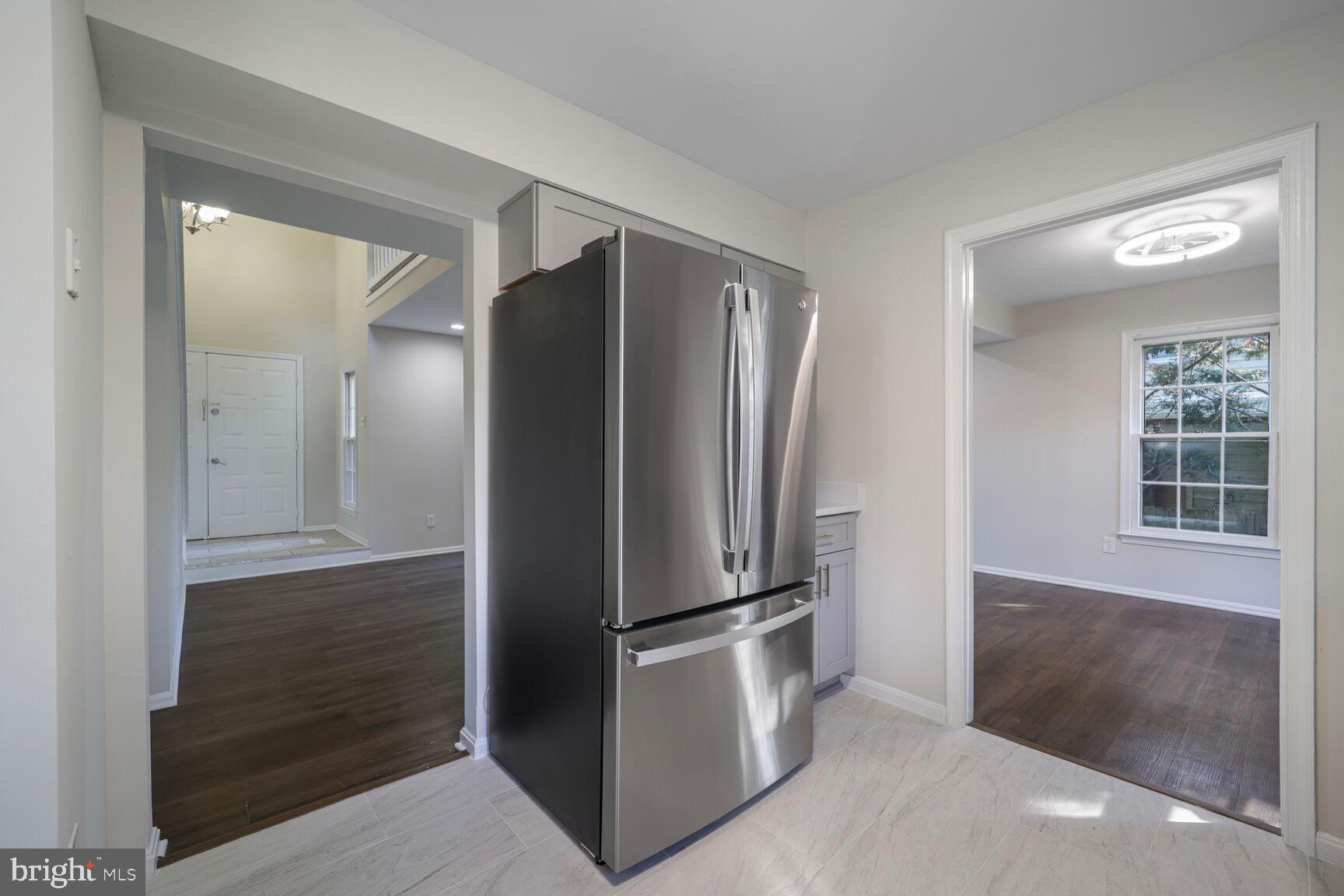 13802 Poplar Tree Road Chantilly, VA 20151 - Photo 16 of 61 an empty room with wooden floor and a window