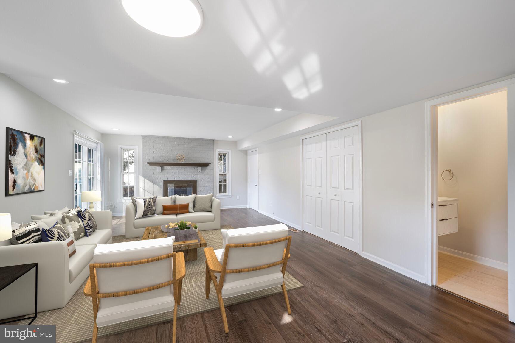 13802 Poplar Tree Road Chantilly, VA 20151 - Photo 18 of 61 a living room with fireplace furniture and a wooden floor