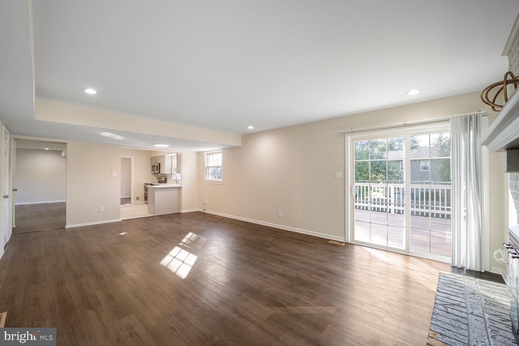 13802 Poplar Tree Road Chantilly, VA 20151 - Photo 20 of 61 an empty room with wooden floor and windows