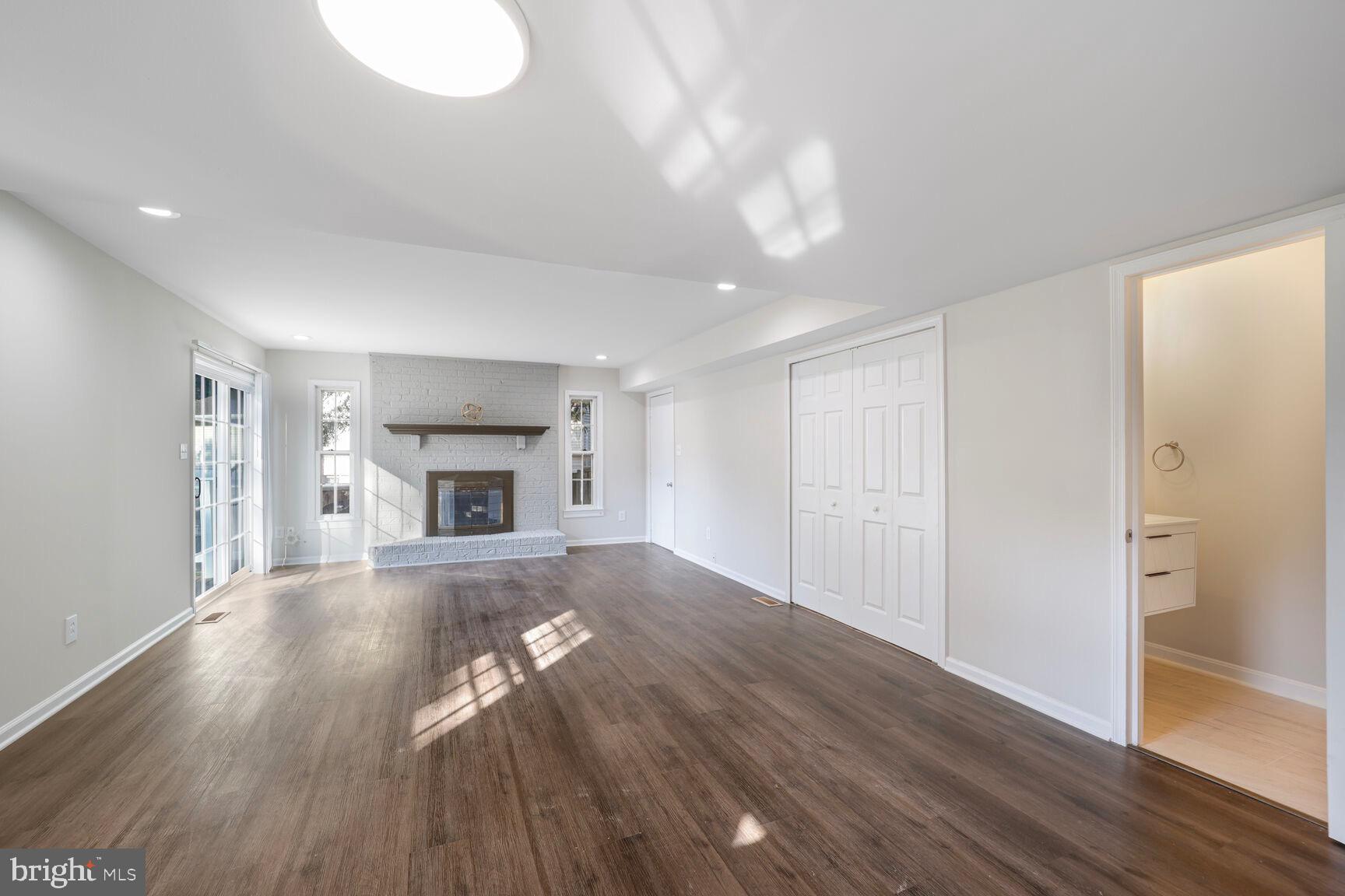 13802 Poplar Tree Road Chantilly, VA 20151 - Photo 23 of 61 a view of empty room with wooden floor and fireplace
