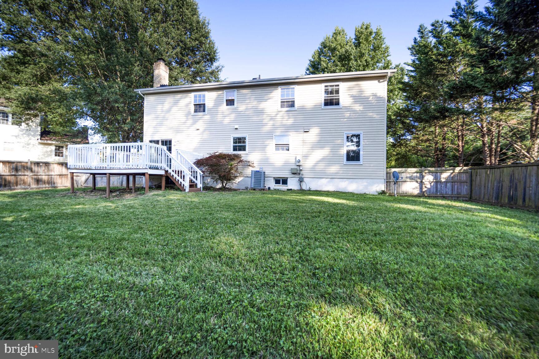 13802 Poplar Tree Road Chantilly, VA 20151 - Photo 51 of 61 a view of house with backyard