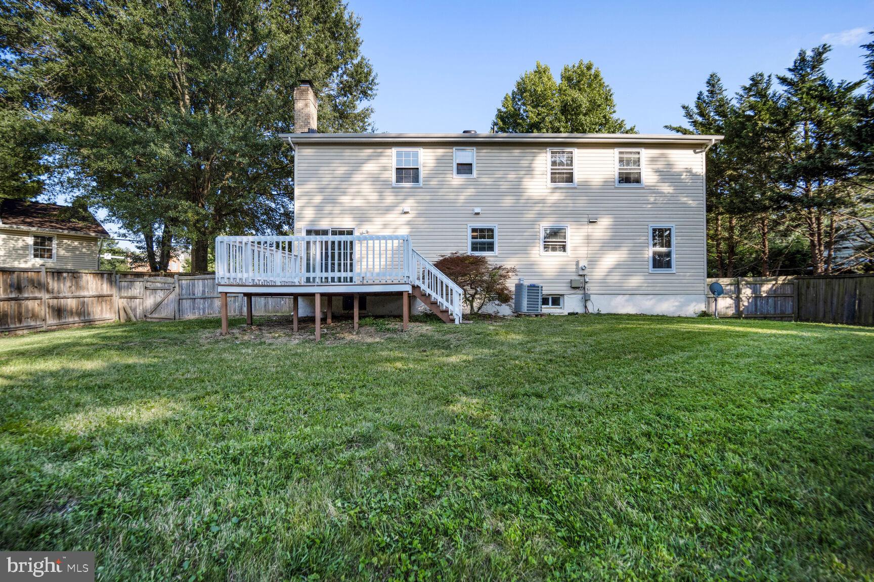13802 Poplar Tree Road Chantilly, VA 20151 - Photo 52 of 61 a view of a house with backyard and a sitting area